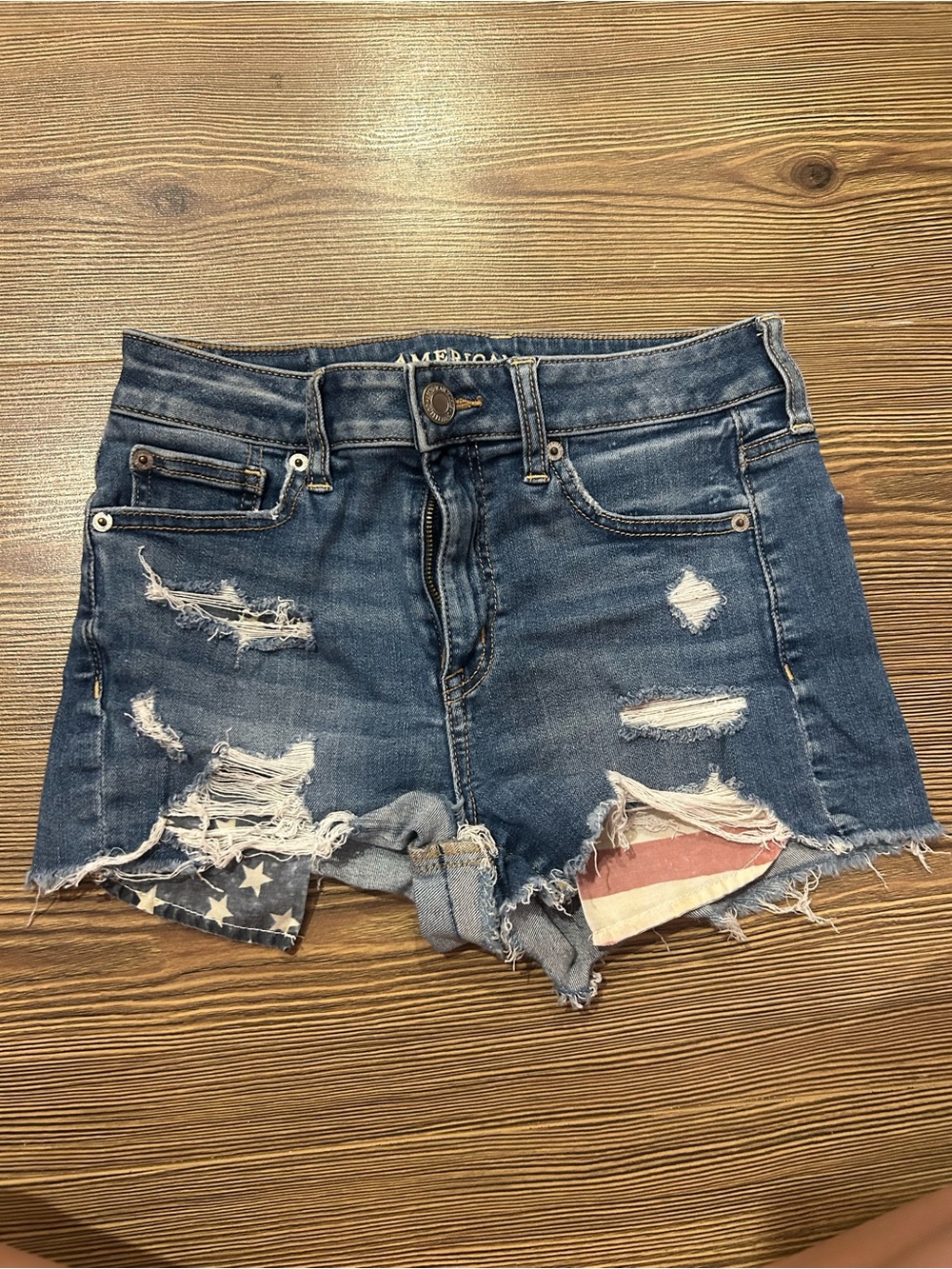 American Eagle Outfitters Distressed Blue Denim Shorts with Flag Accent
